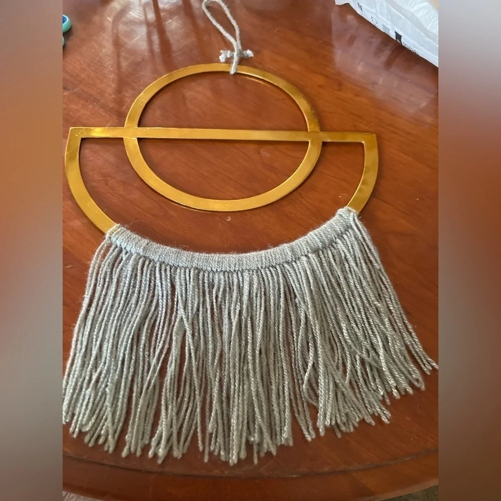 4/$25 Boho Gold finish semi circle metal ring & grey yarn fringe. In EUC.